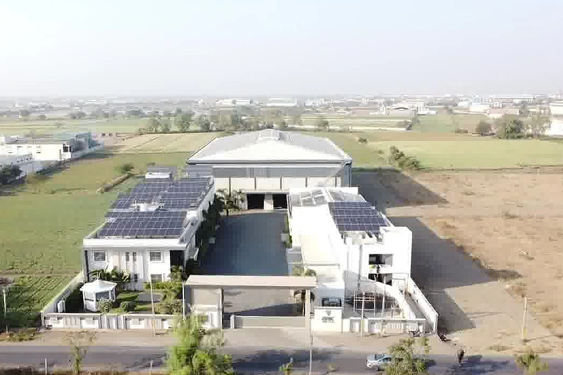 Aerial view of a solar-powered facility installed by Bhanu PV Solar
